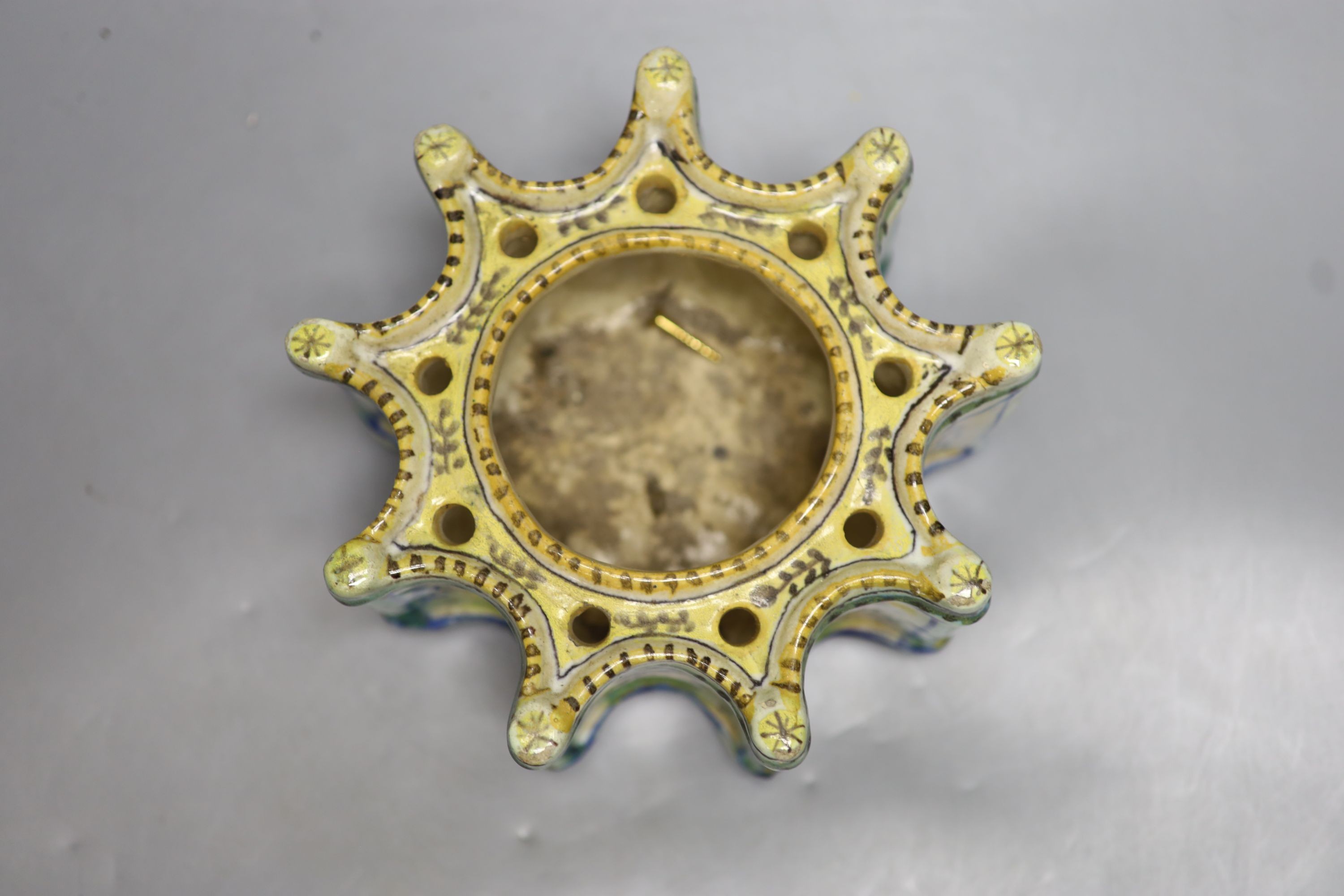 A 19th century Italian maiolica flower holder, of stellar form, 19cm diameter